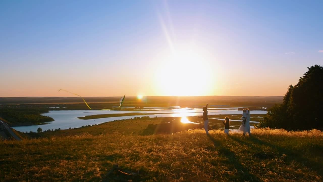 Stock Footage Young Family Flying A Kite In The Sunset Live Wallpaper Free