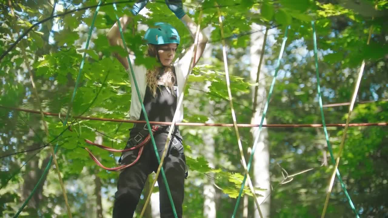 Stock Footage Young Woman Crossing The Ropes In The Woods Live Wallpaper Free