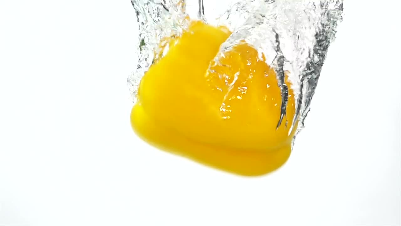 Stock Footage Yellow Pepper Falling Through The Water Live Wallpaper Free