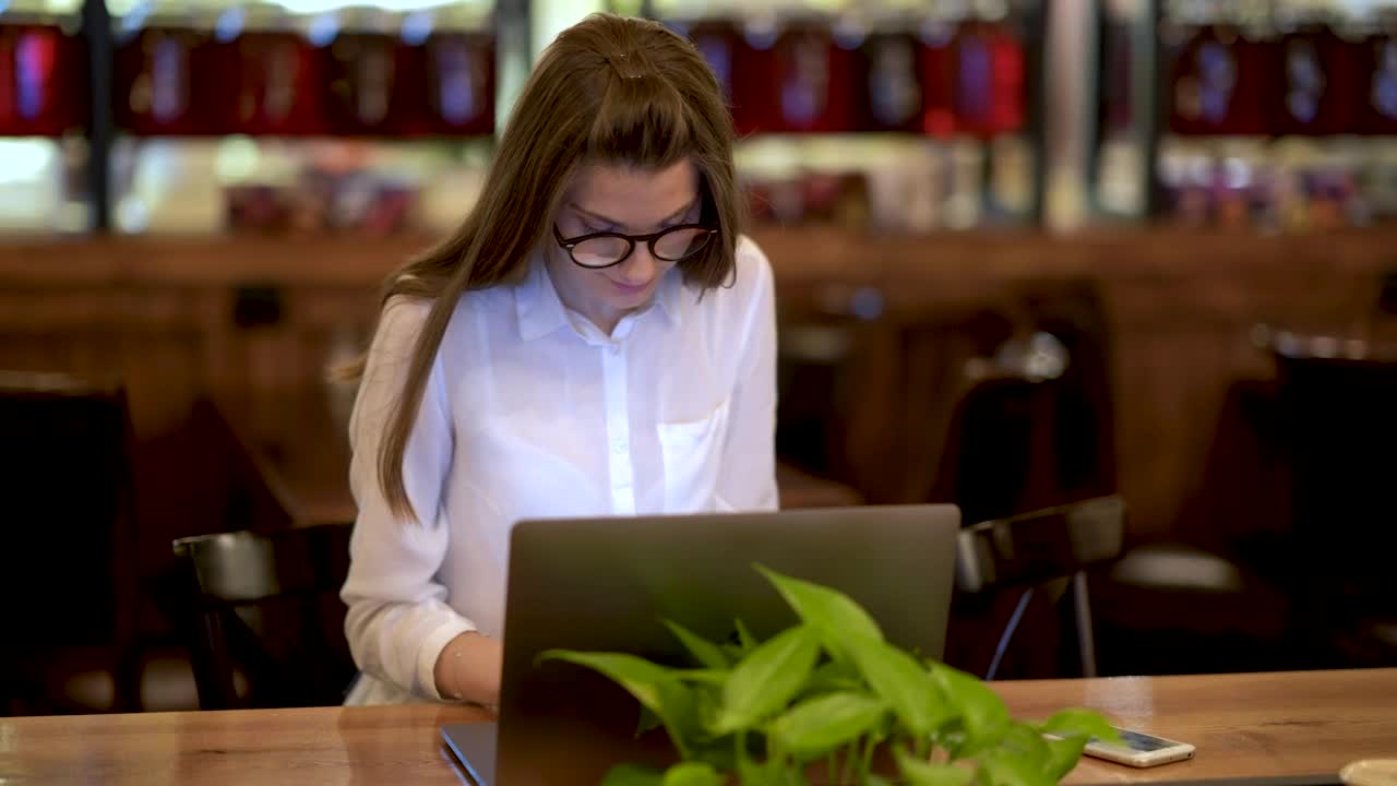 Stock Footage Young Woman Working On A Laptop And Talking On The Live Wallpaper Free