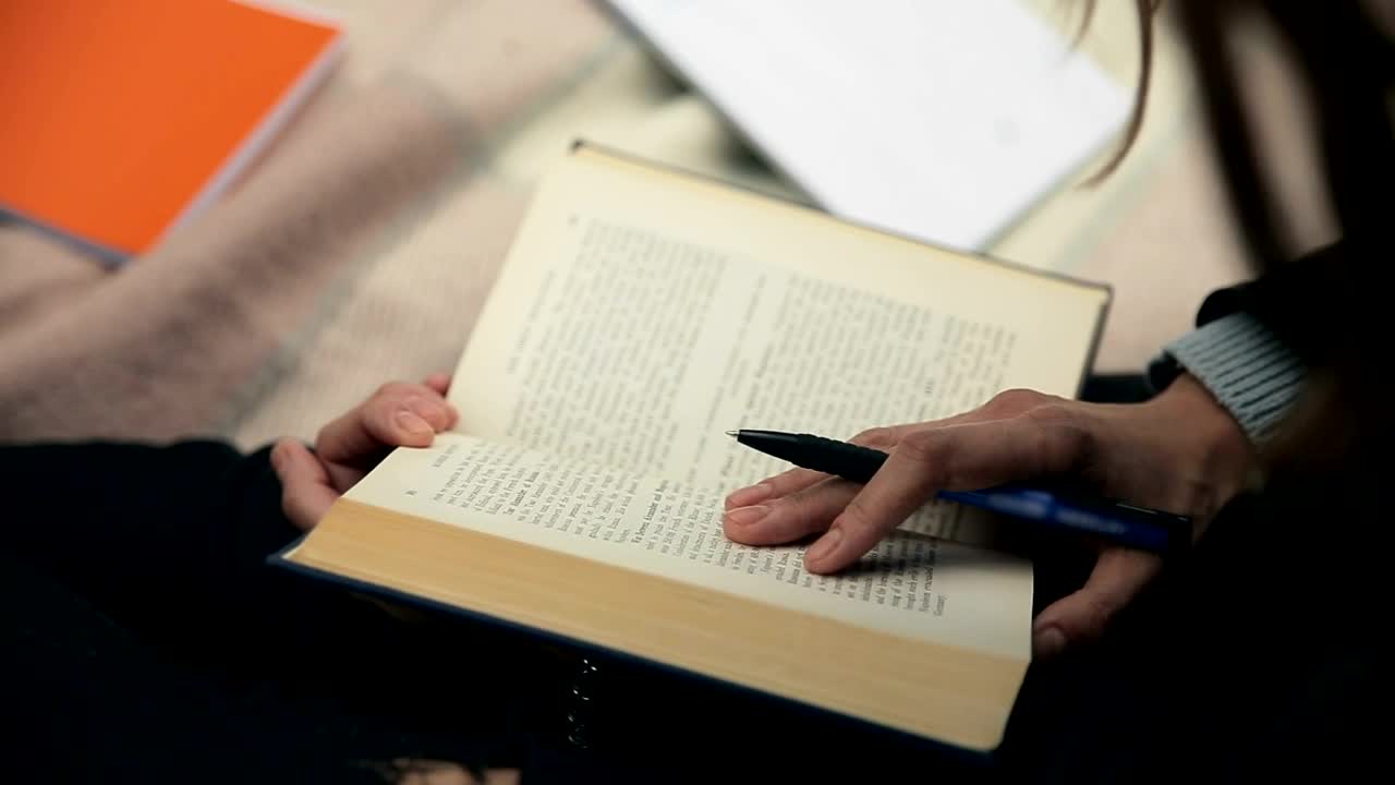 Stock Footage Writer Researching Old Book And Taking Notes Live Wallpaper Free