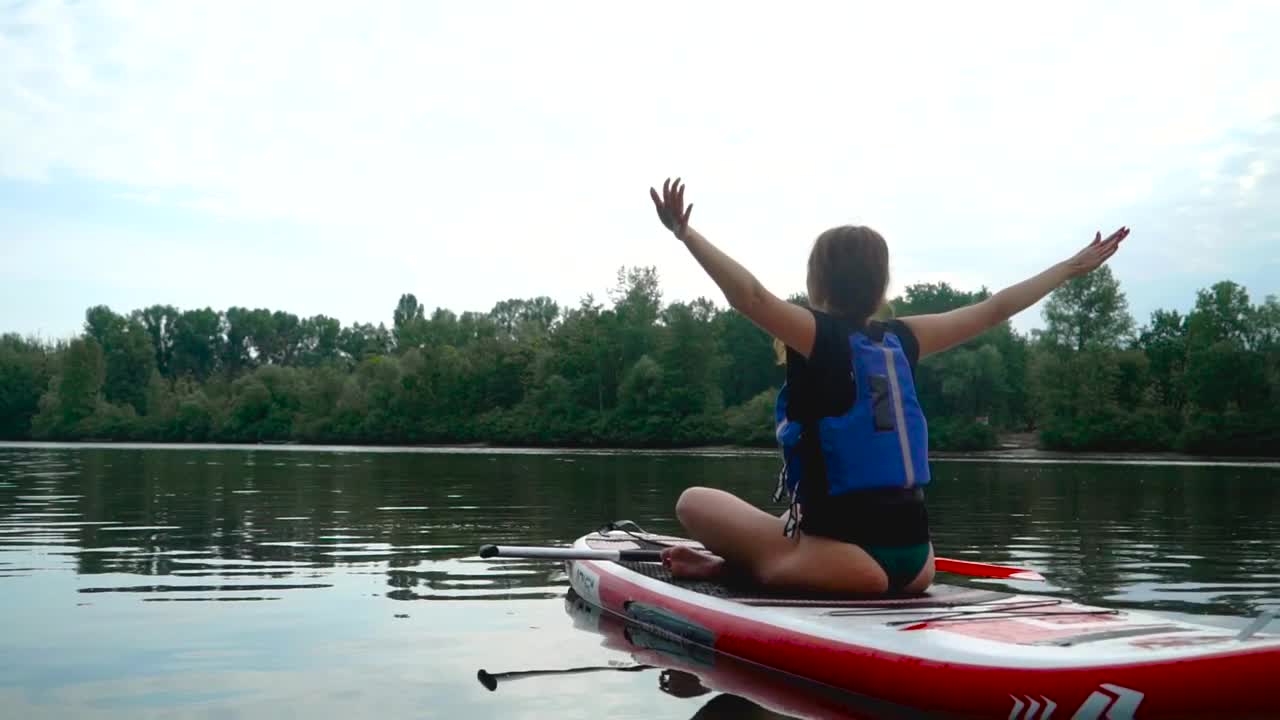 Stock Footage Woman Does Yoga Routine On Paddle Board In River Live Wallpaper Free