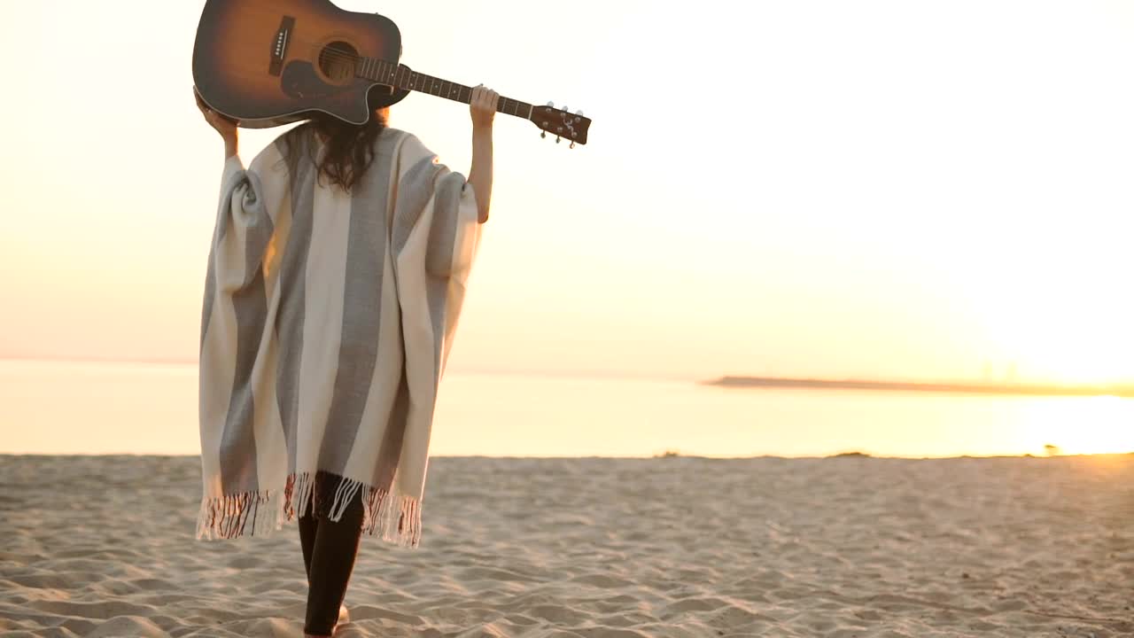 Stock Footage Woman Walks On Sunset Beach With Acoustic Guitar Live Wallpaper Free