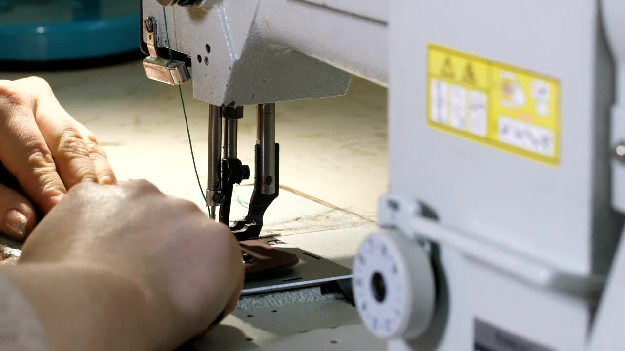 Stock Footage Woman Using A Sewing Machine At Home Live Wallpaper Free
