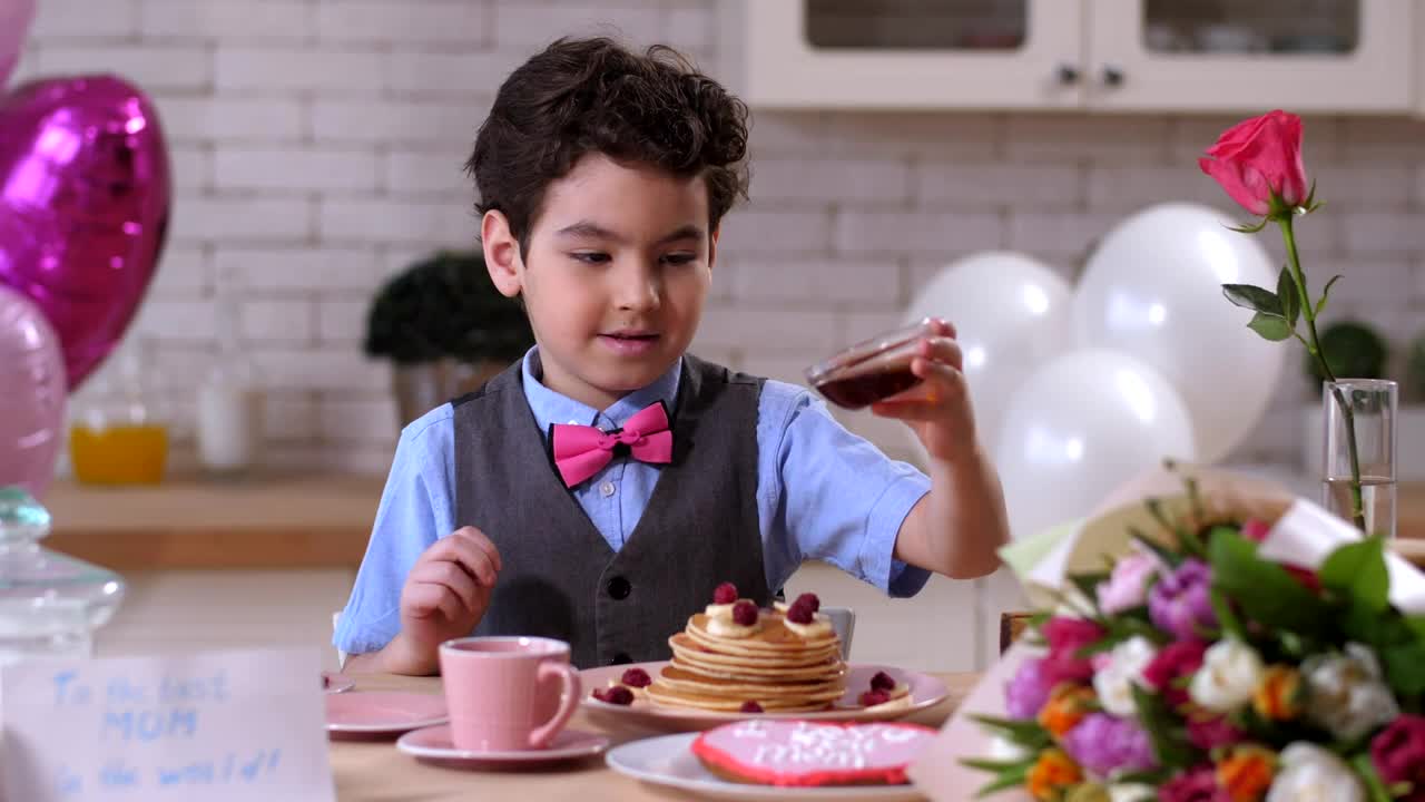 Stock Footage Young Boy Pouring Syrup Over Pancakes Live Wallpaper Free