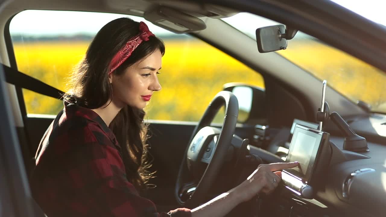Stock Footage Woman Setting Up Her Gps For A Trip Live Wallpaper Free