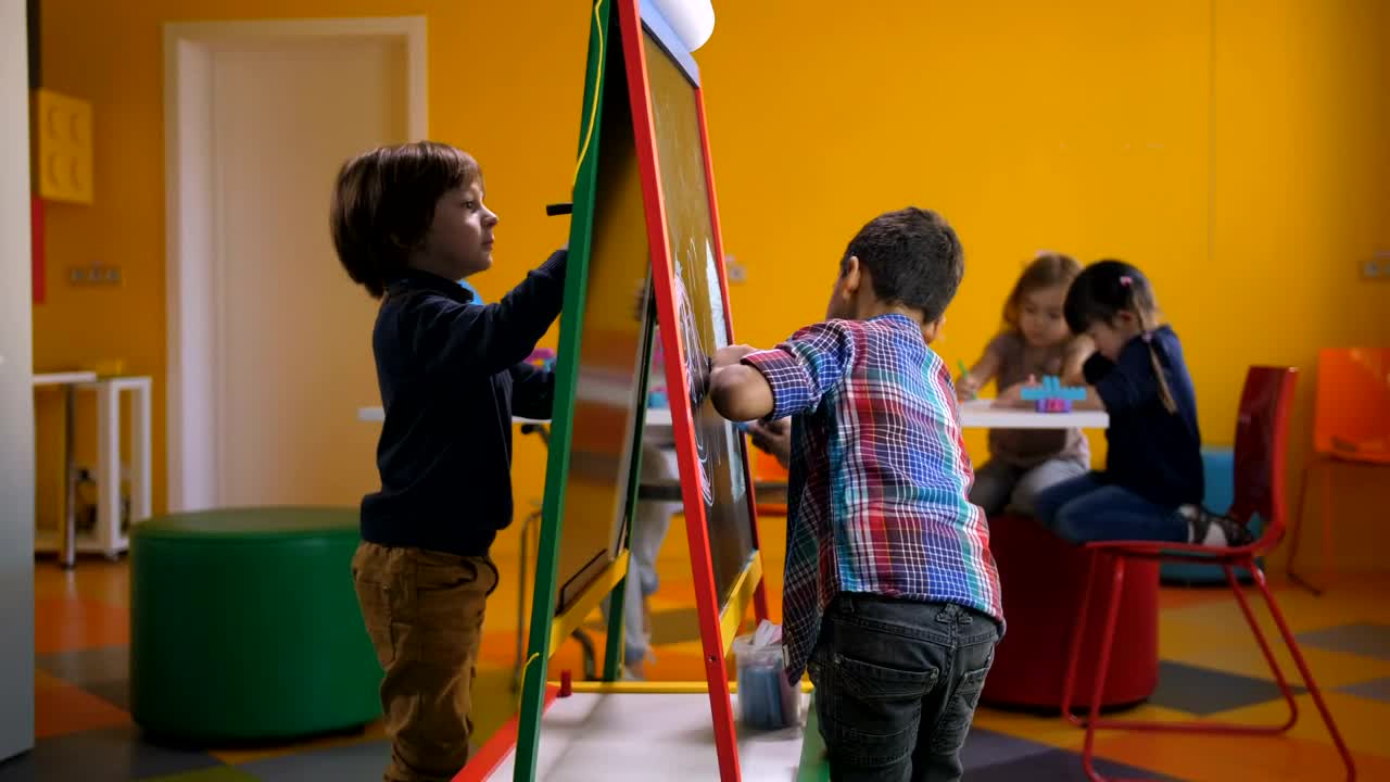 Stock Footage Young Boys Drawing Together Live Wallpaper Free