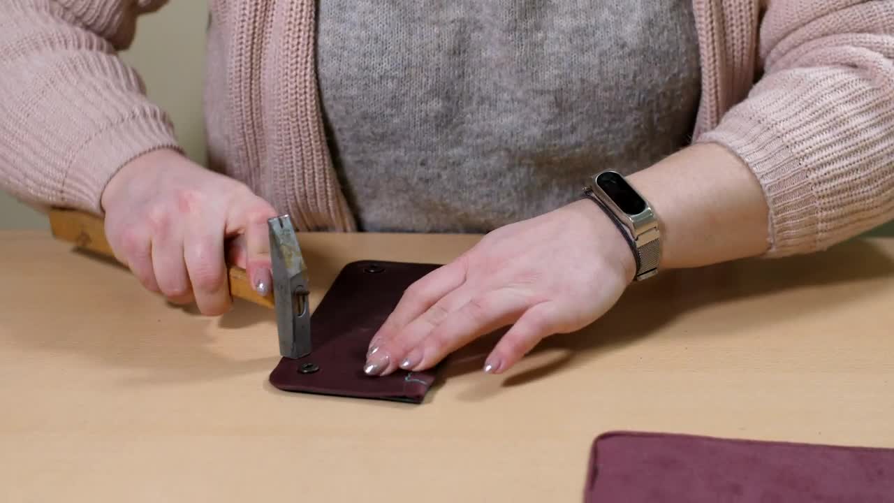 Stock Footage Woman Repairing A Wallet Live Wallpaper Free