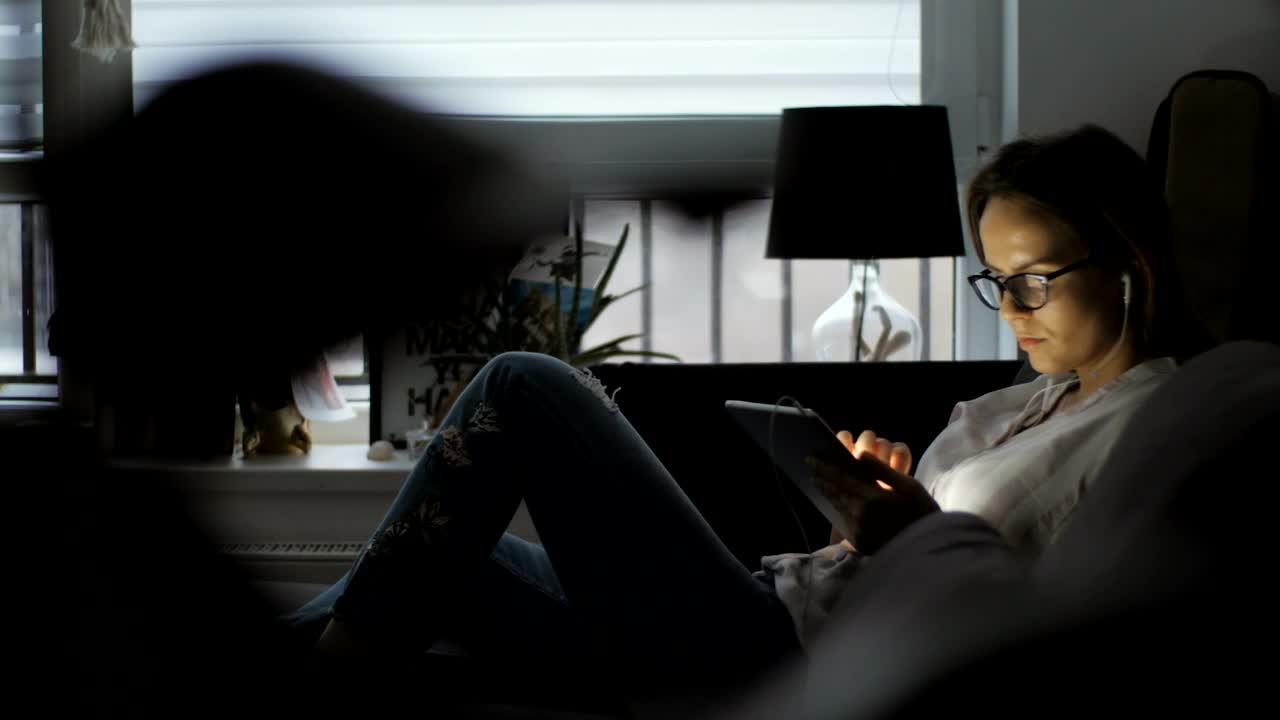 Stock Footage Young Woman With Tablet On The Couch Live Wallpaper Free
