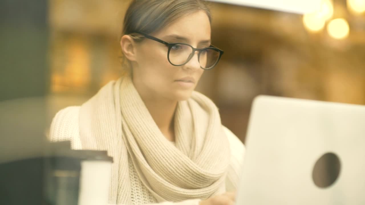 Stock Footage Woman Working On A Laptop At The Coffee Shop Live Wallpaper Free