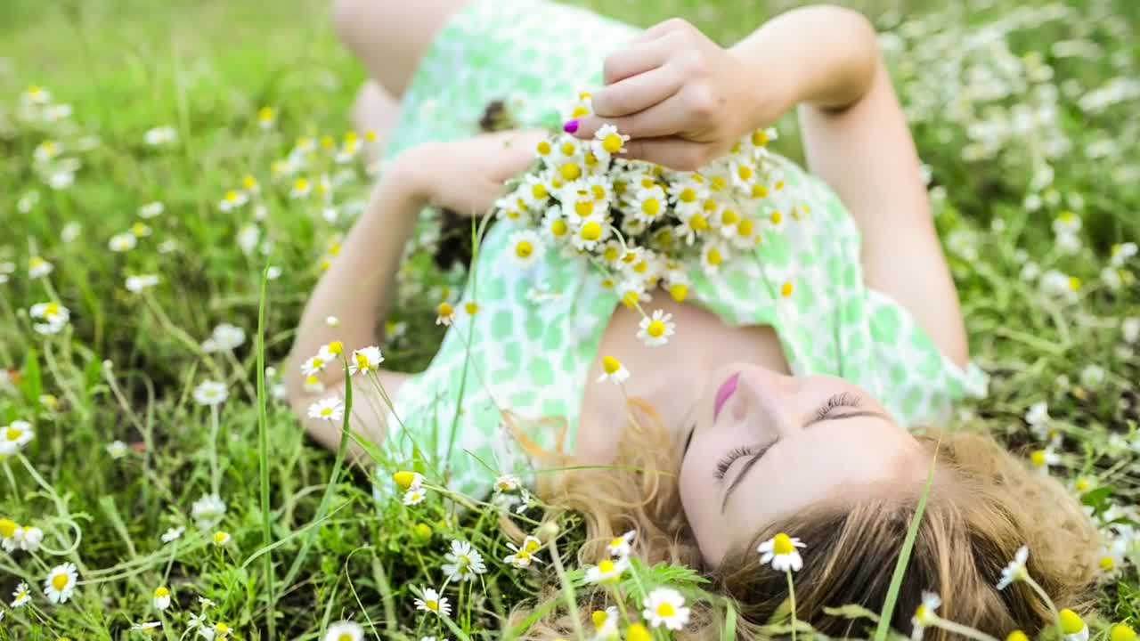 Stock Footage Woman Lying On The Meadow With A Bouquet Of Small Live Wallpaper Free