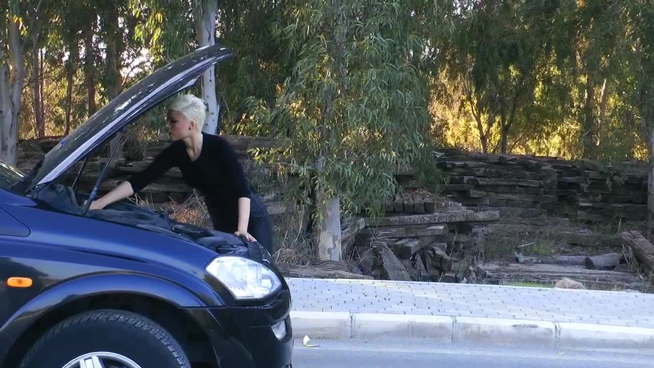 Stock Footage Woman Trying To Fix Her Car Engine Live Wallpaper Free