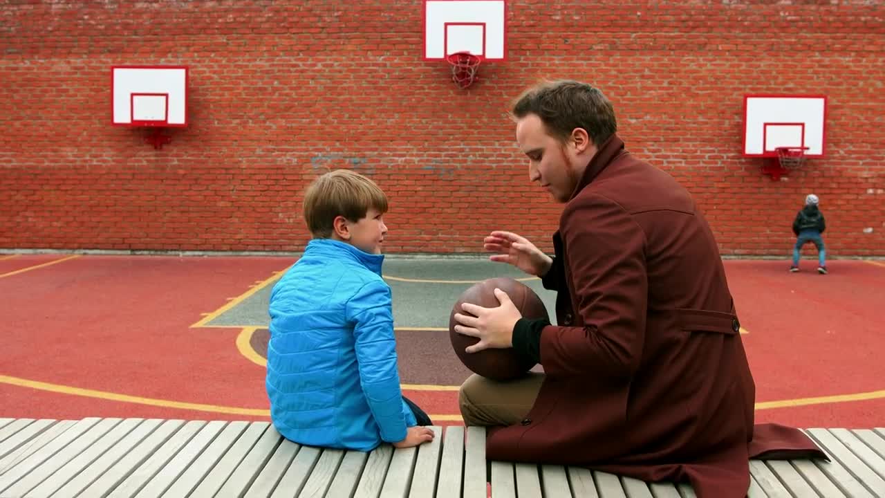 Stock Footage Young Man And His Little Brother On The Basketball Playground Live Wallpaper Free