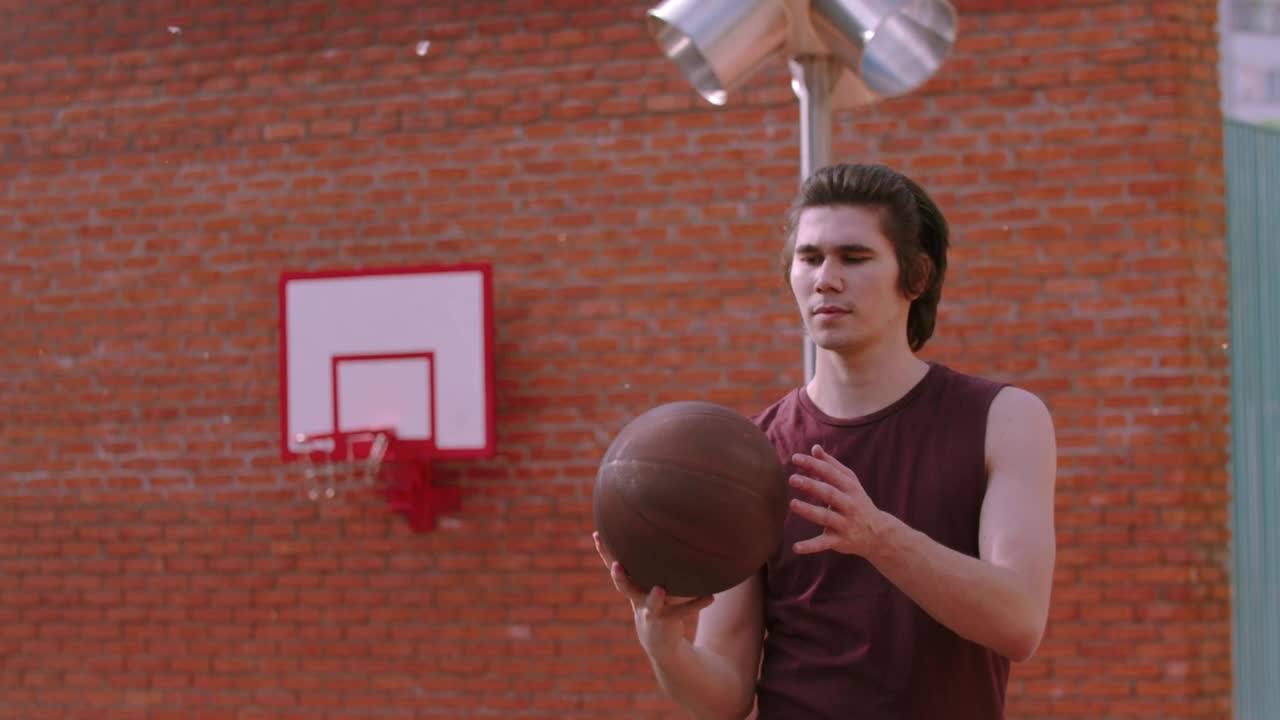 Stock Footage Young Man Spinning A Basketball Ball On The Finger Live Wallpaper Free