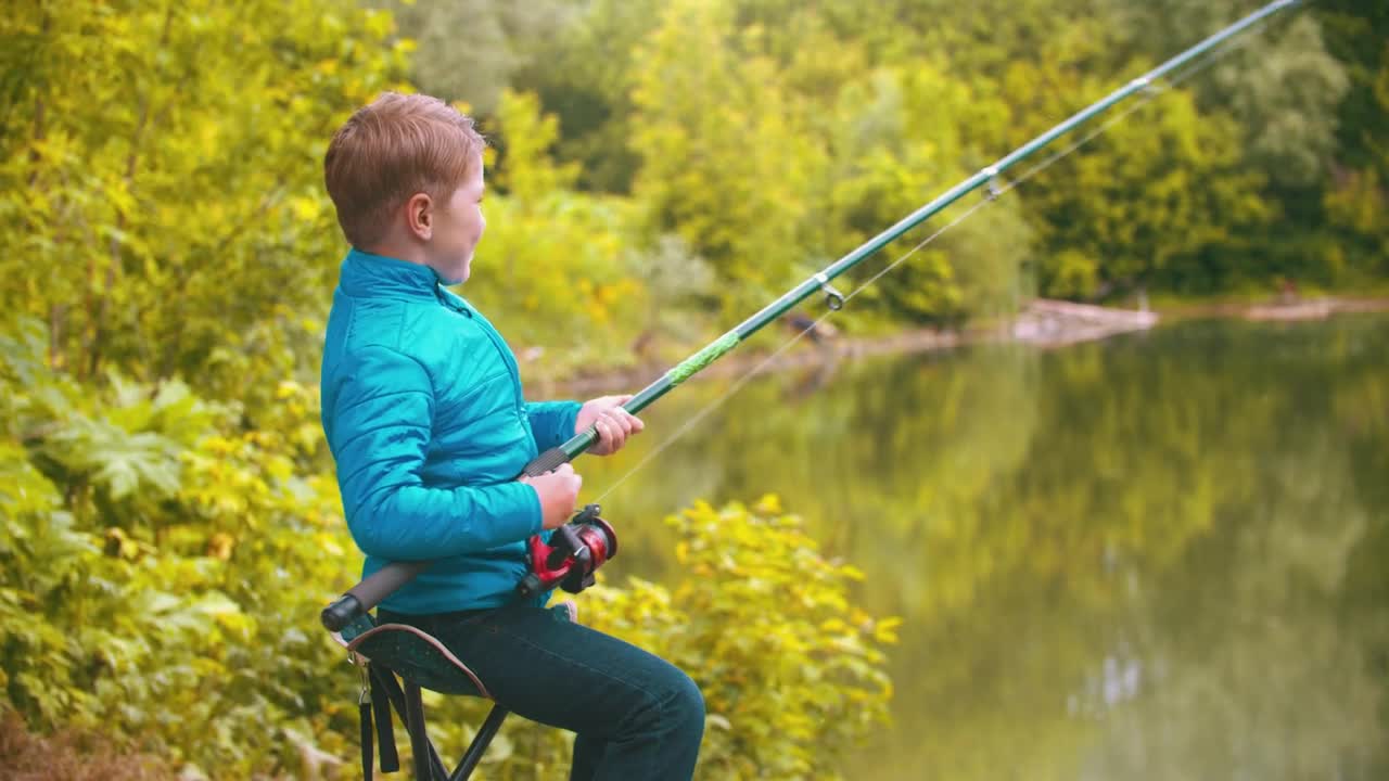 Stock Footage Young Boy With A Fishing Rod At The Lake Live Wallpaper Free