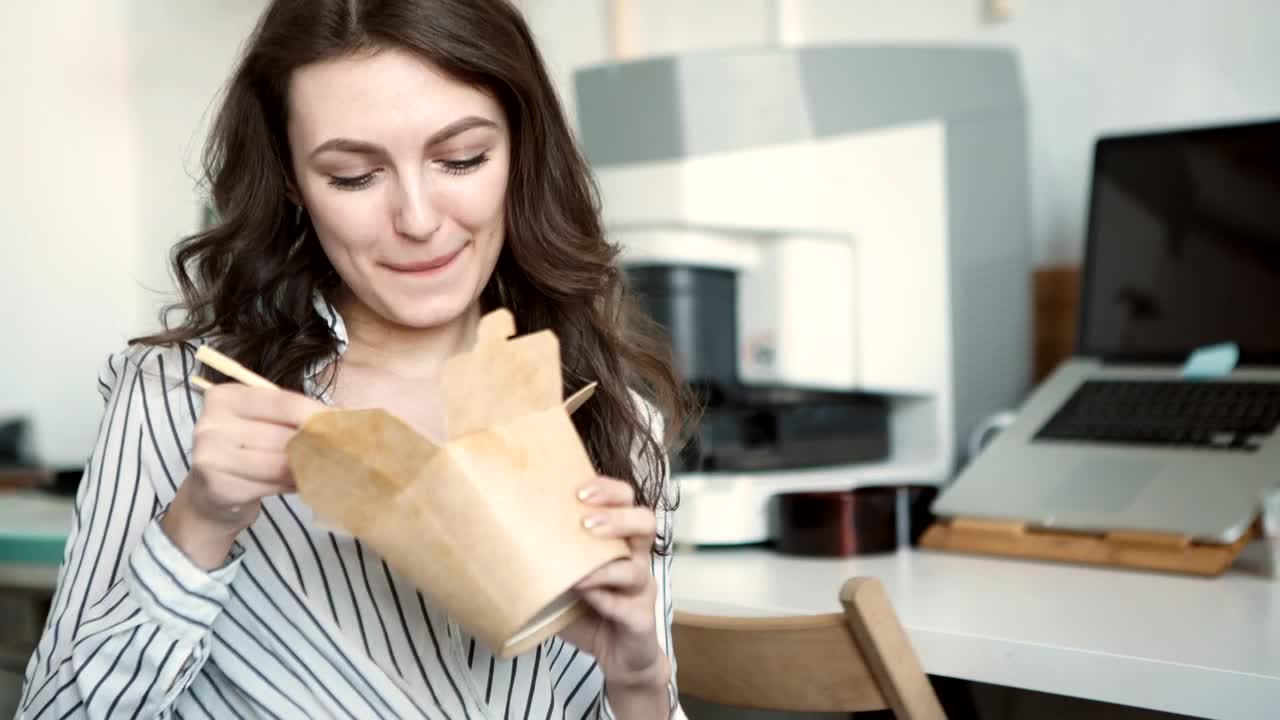 Stock Footage Young Woman Eating Takeout Food On Office Break Live Wallpaper Free