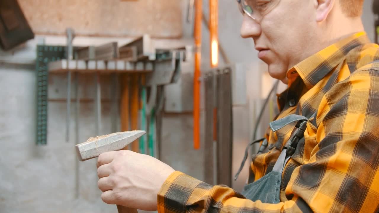 Stock Footage Woodworker Blowing Off Dust From The Hammer Live Wallpaper Free