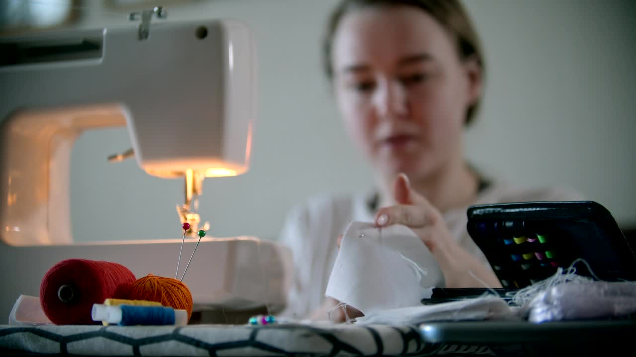 Stock Footage Woman Sewing A Protective Mask For The Pandemic Live Wallpaper Free