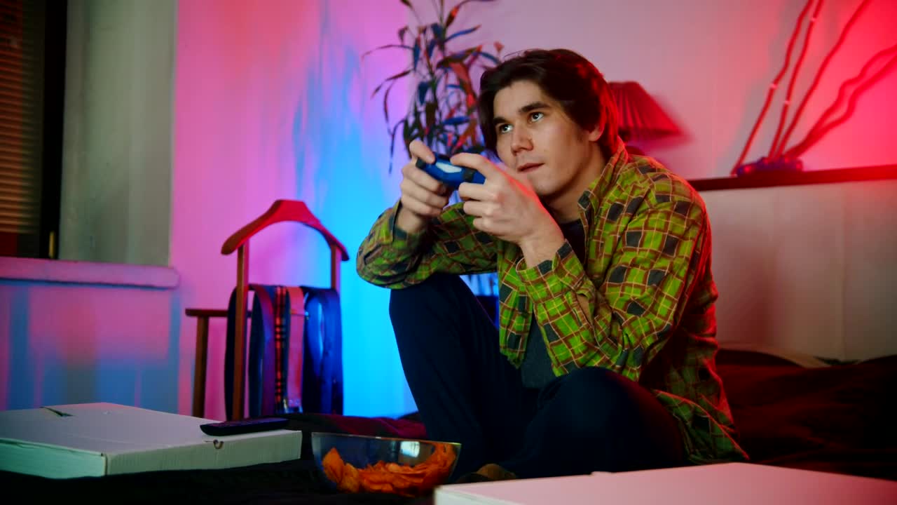 Stock Footage Young Man Plating Video Games On The Bed Live Wallpaper Free