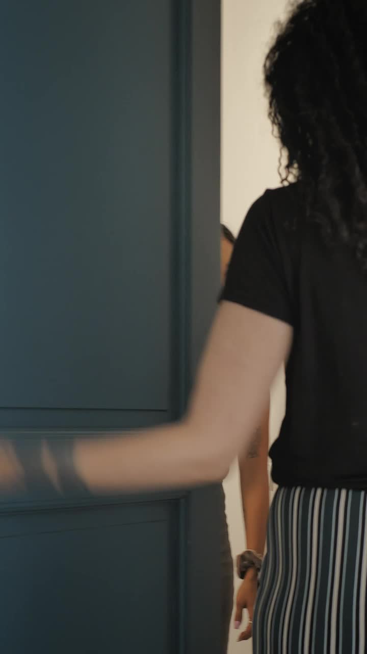 Stock Footage Woman Is Lovingly Welcomed At Her Friends House Live Wallpaper Free