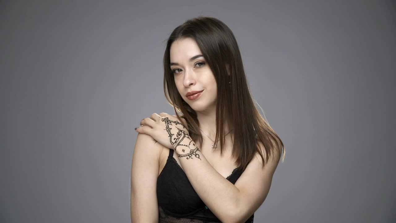 Stock Footage Woman With A Temporary Tattoo Live Wallpaper Free