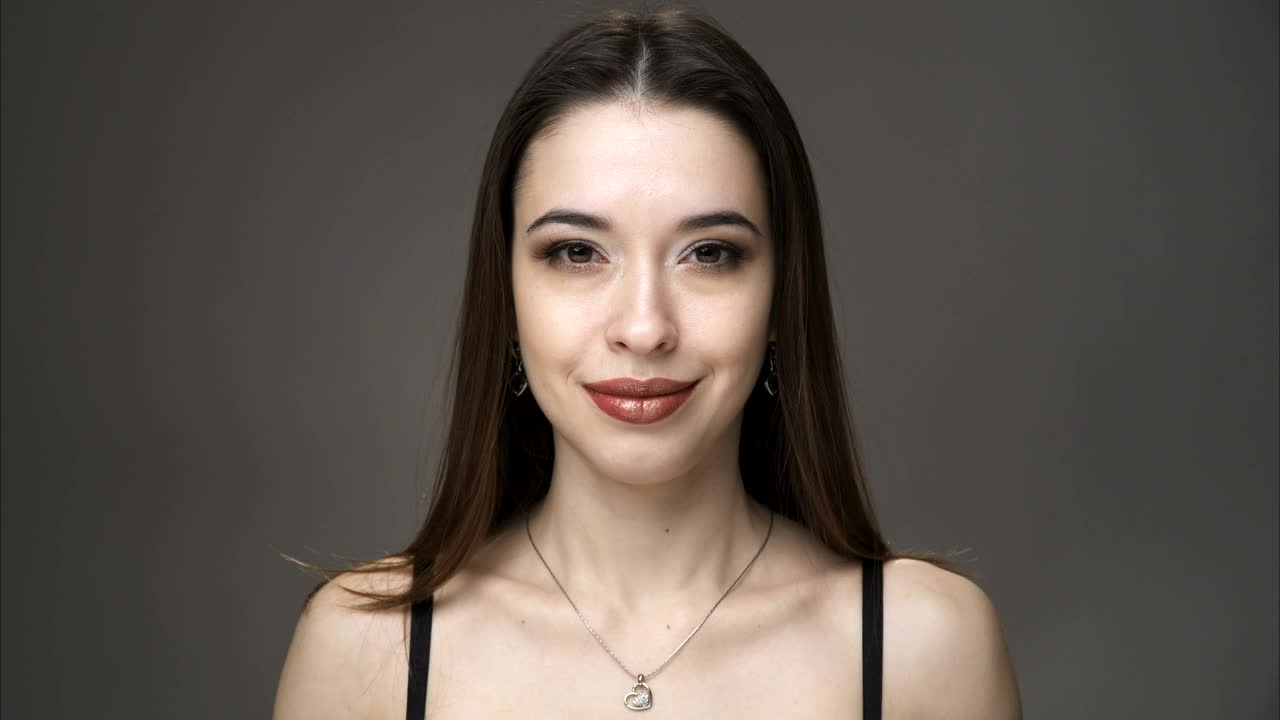 Stock Footage Woman Smiling And Playing With Her Hair Live Wallpaper Free