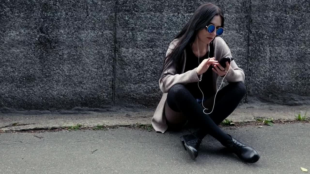 Stock Footage Woman Sitting With Her Phone Live Wallpaper Free