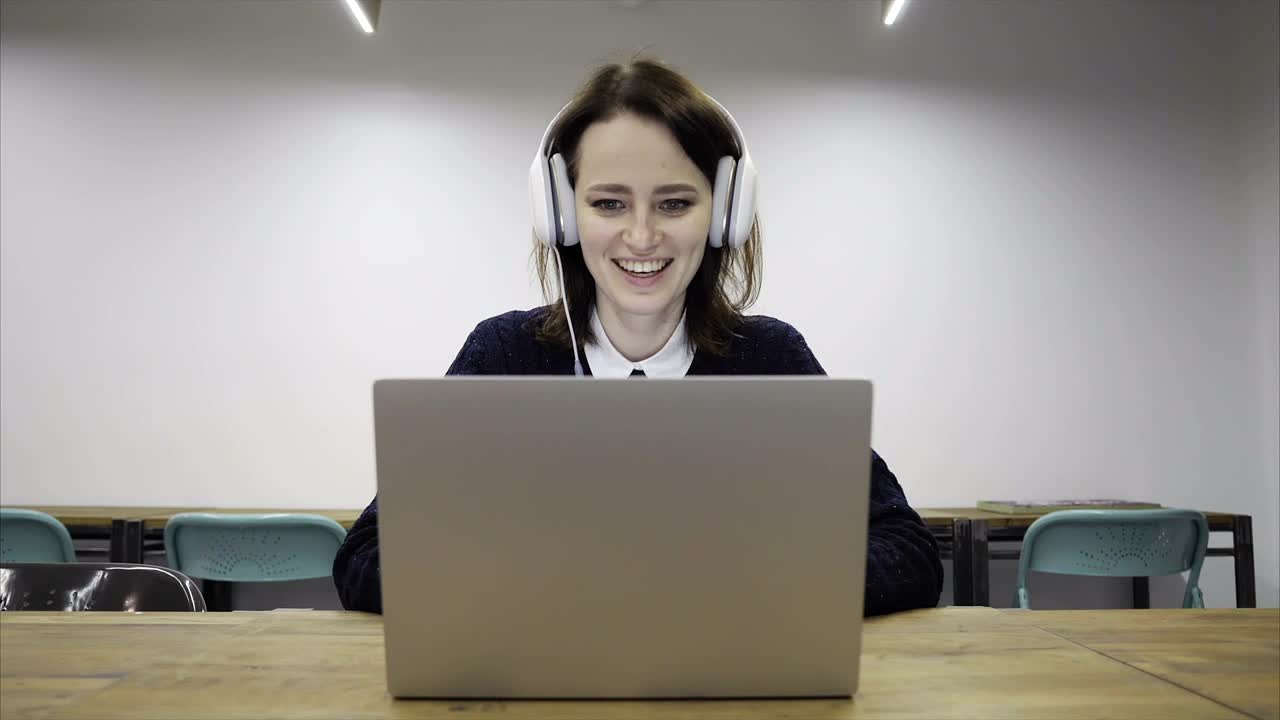 Stock Footage Woman Talking Online With Headphones Live Wallpaper Free