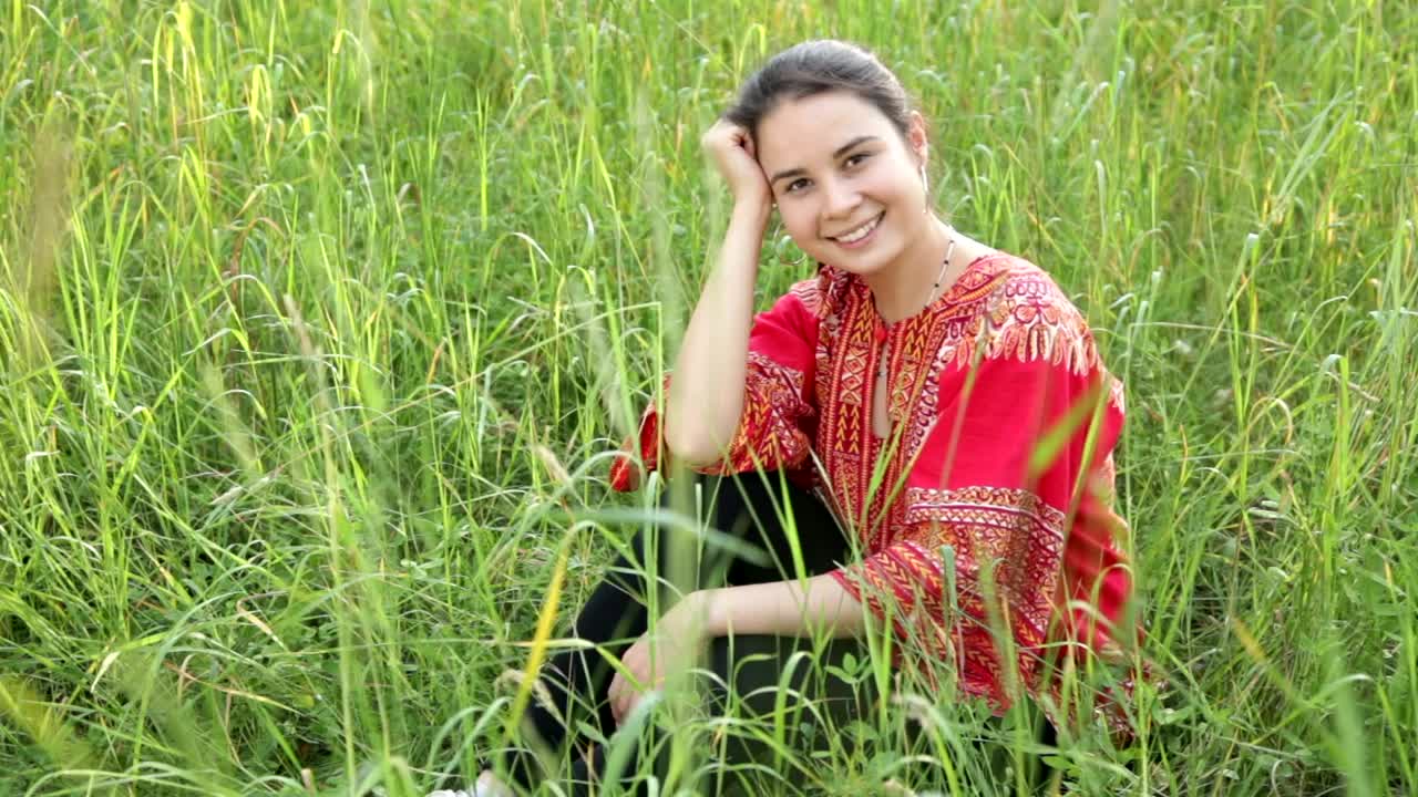 Stock Footage Woman Sitting In A Field Of Long Grass Live Wallpaper Free