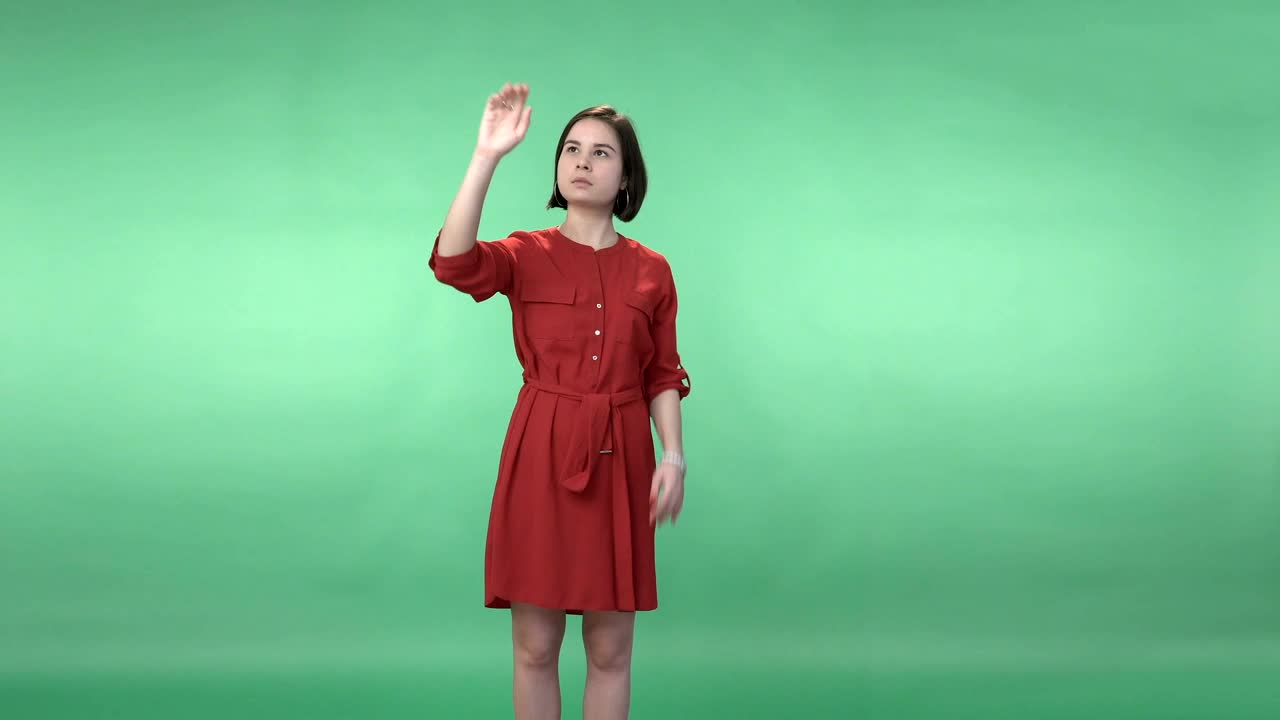 Stock Footage Woman In A Dress Using A Virtual Screen Live Wallpaper Free