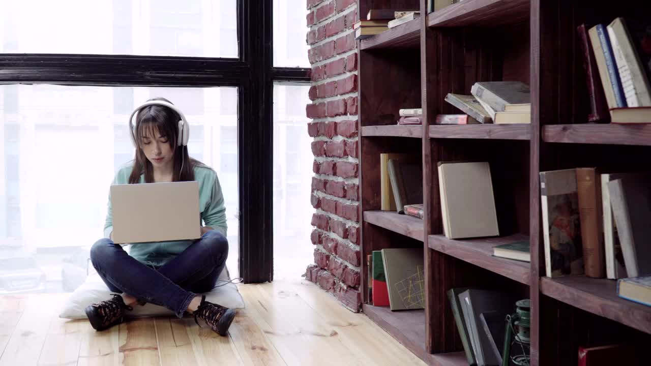 Stock Footage Woman Listing To Music While Typing Live Wallpaper Free