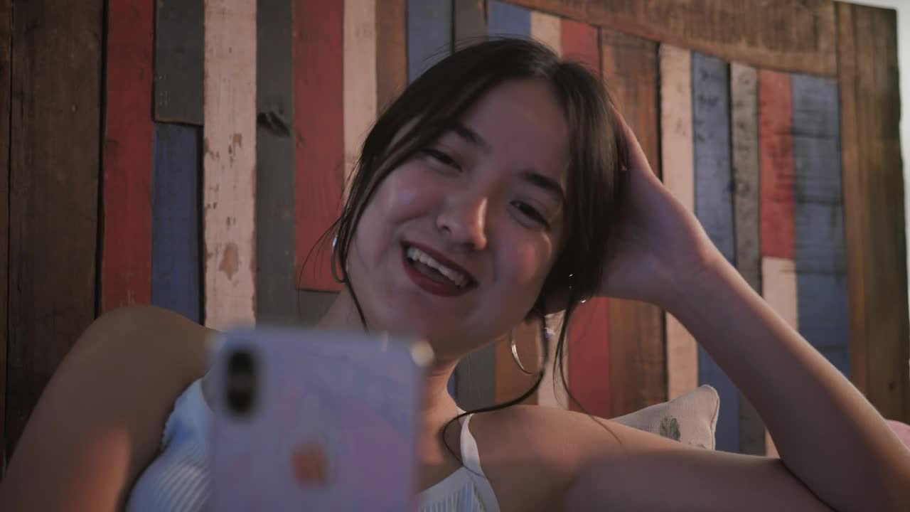 Stock Footage Woman Laughing Out Loud During A Video Call Live Wallpaper Free