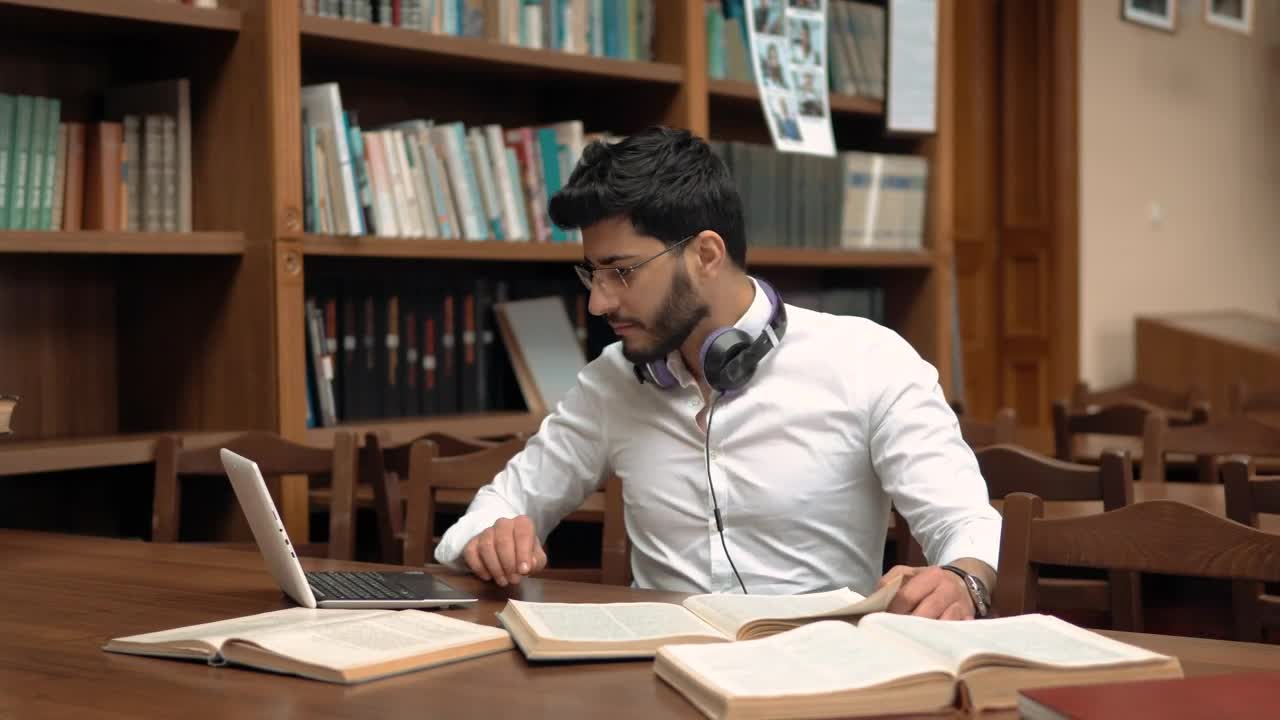 Stock Footage Woman Helping A Classmate With Homework In The Library Live Wallpaper Free