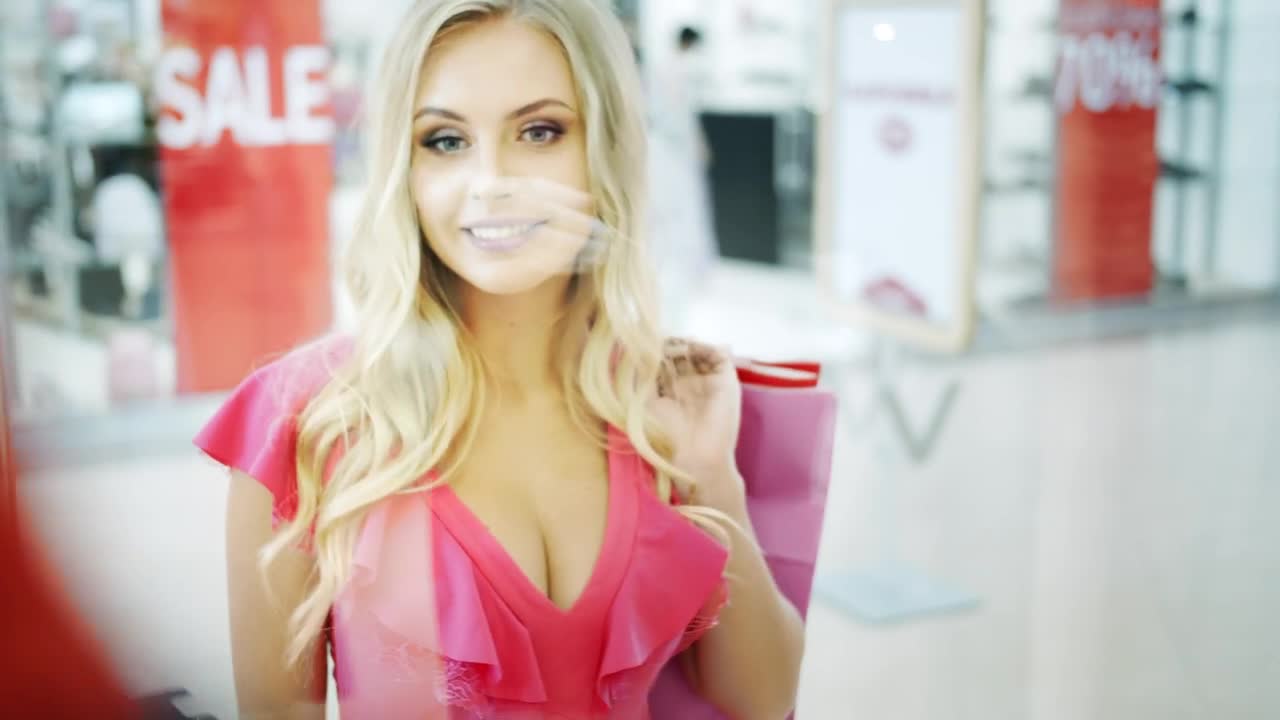 Stock Footage Woman Looks Into Shopping Mall Showcase Live Wallpaper Free