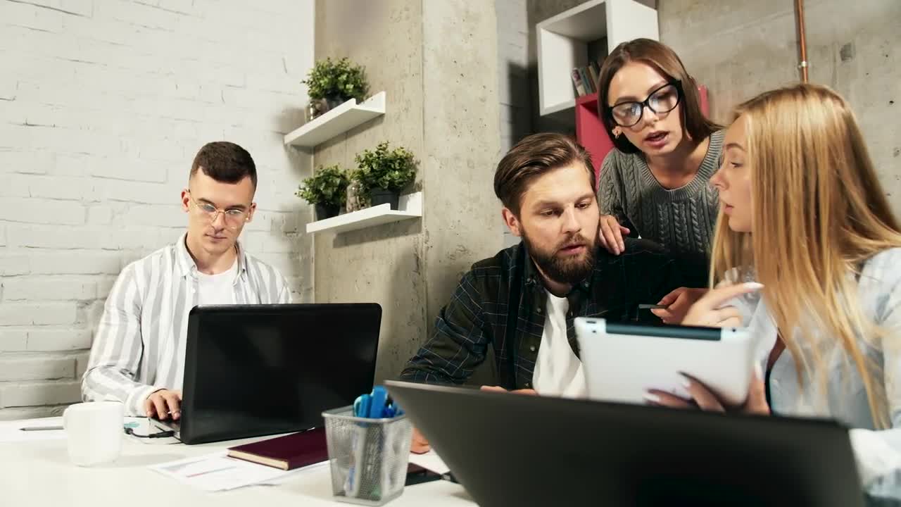 Stock Footage Young Team Brainstorms Ideas While Working In Modern Office Live Wallpaper Free