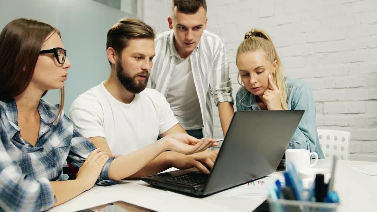 Stock Footage Young Marketing Team Gather Around Laptop Live Wallpaper Free