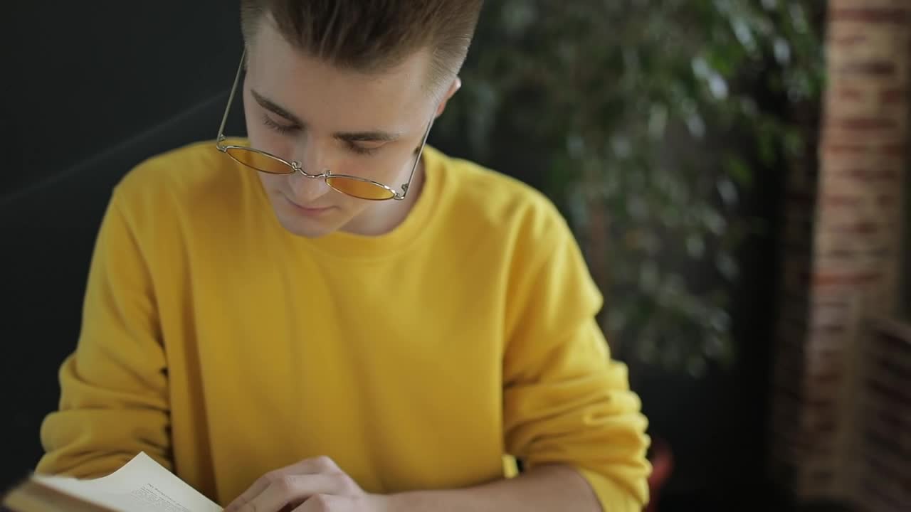 Stock Footage Young Student Studies For Exam Near Sunny Window Live Wallpaper Free