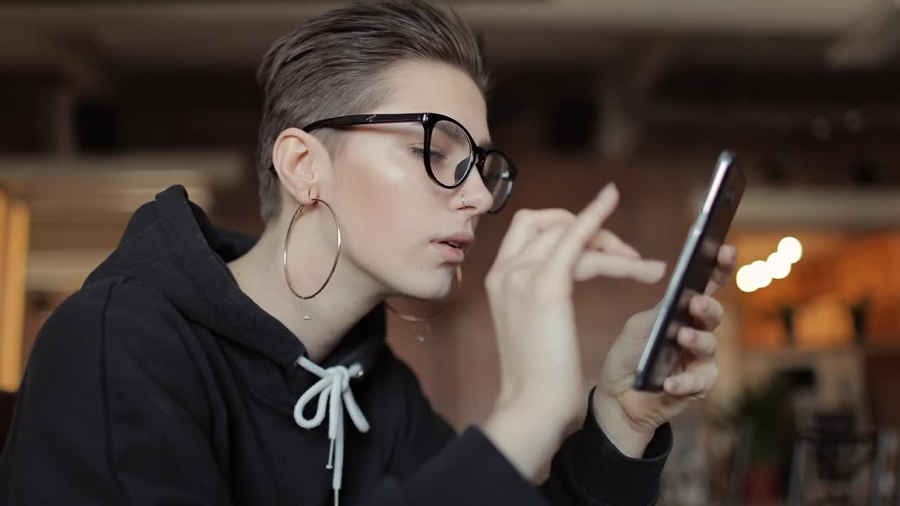 Stock Footage Young Girl Interacts With Subscribers On Mobile Phone Live Wallpaper Free