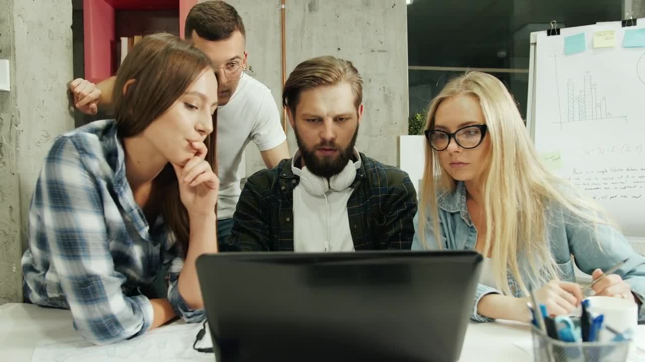 Stock Footage Young Creative Team Celebrate Win Over Laptop Live Wallpaper Free