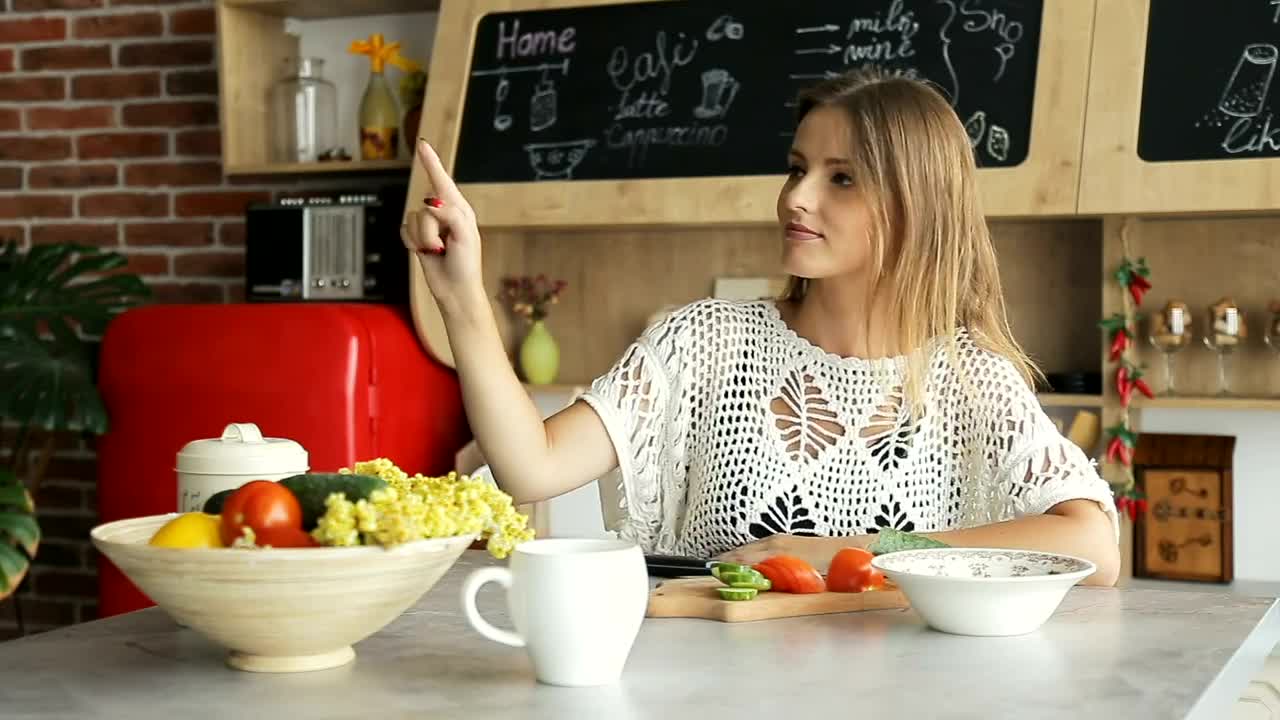 Stock Footage Woman Watches Futuristic Hologram Panel In Kitchen Live Wallpaper Free