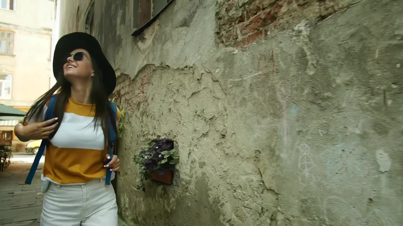 Stock Footage Woman Touring Rome Looks Up At Old Building Live Wallpaper Free