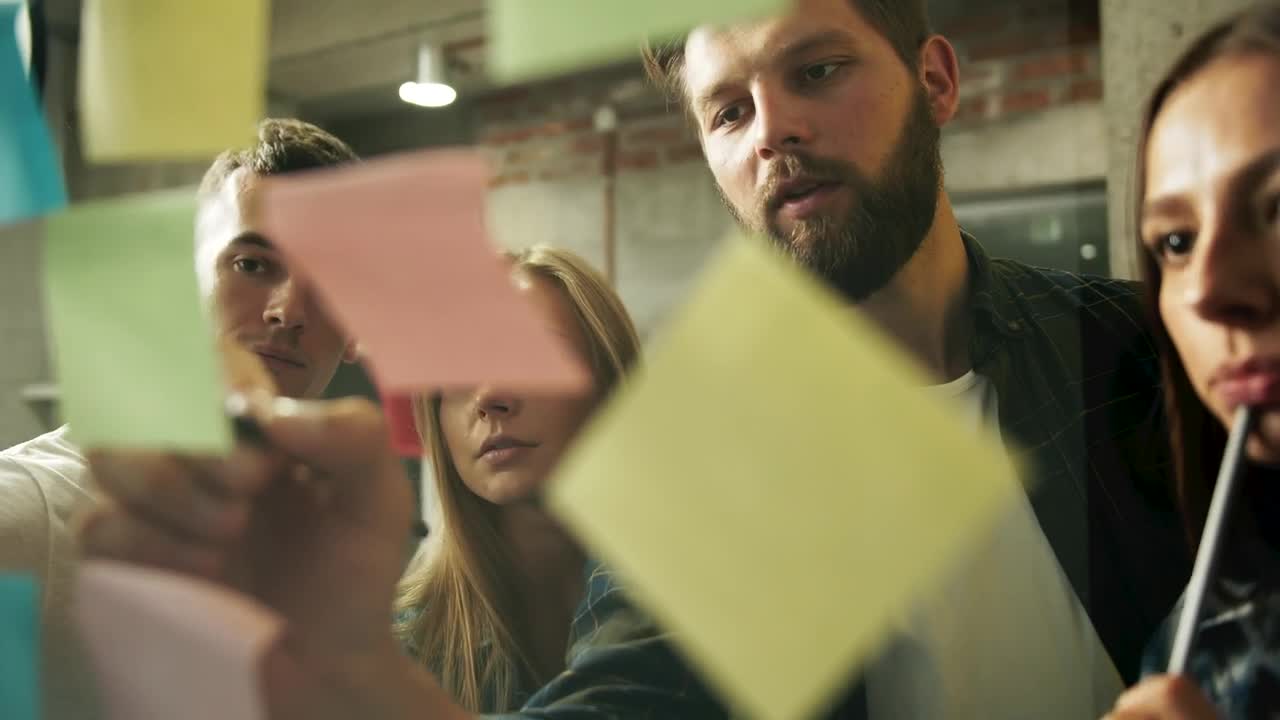 Stock Footage Young Team Brainstorms Ideas With Sticky Notes Live Wallpaper Free