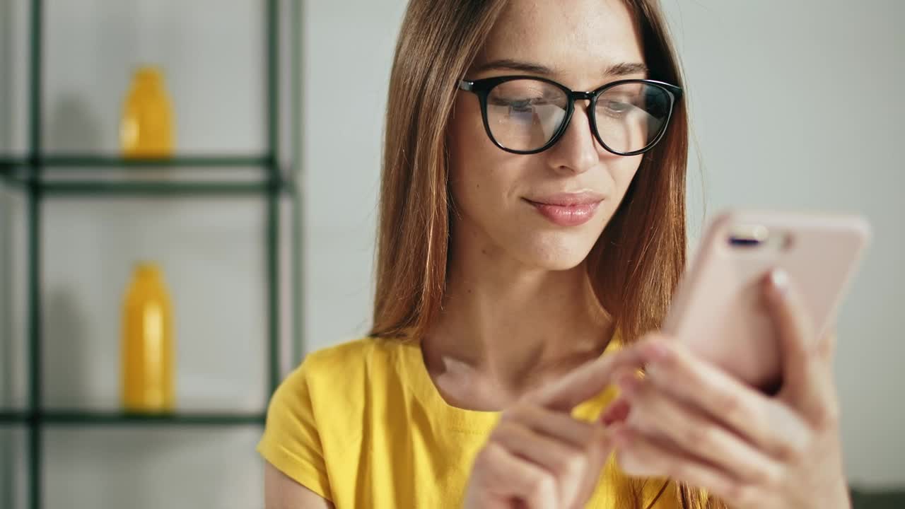 Stock Footage Young Woman Using Smartphone App Touchscreen Live Wallpaper Free