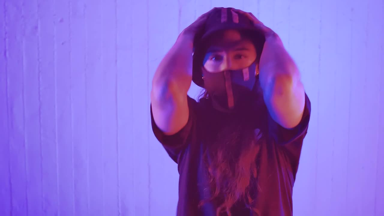 Stock Footage Young Woman With A Face Mask Dancing Facing The Shot Live Wallpaper Free