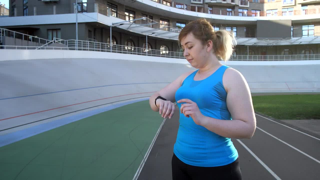 Stock Footage Woman Using A Fitness Gadget Live Wallpaper Free