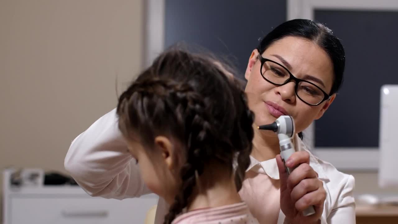 Stock Footage Woman Examining A Sick Girl Live Wallpaper Free