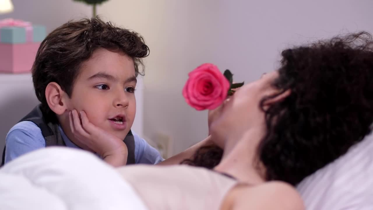 Stock Footage Young Boy Giving His Mother A Flower Live Wallpaper Free