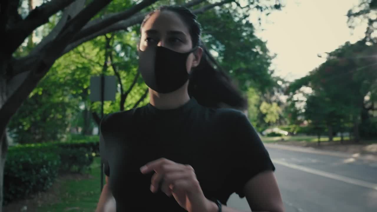 Stock Footage Young Woman Running With Mask On The Street Live Wallpaper Free