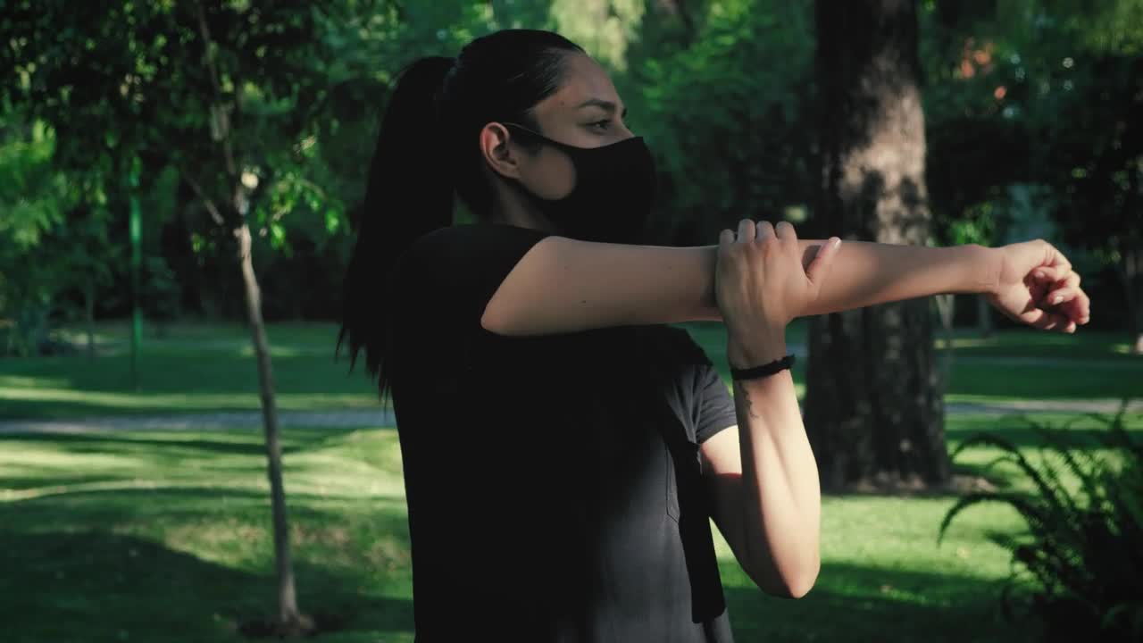 Stock Footage Woman With Face Mask Stretching Before Exercise Live Wallpaper Free
