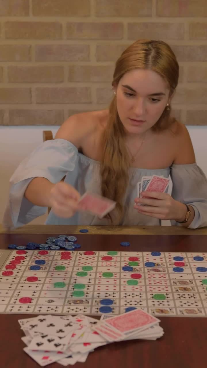 Stock Footage Young Woman Playing A Board Game With Cards Live Wallpaper Free